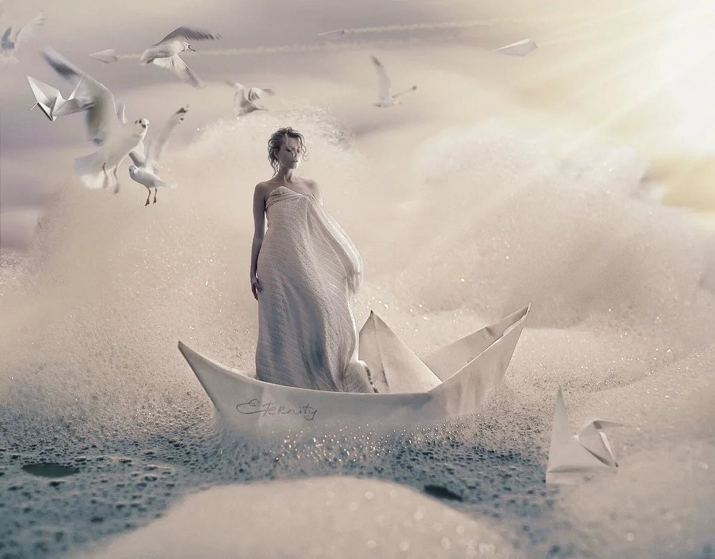 woman in an origami boat