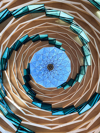 Photo by S T blue and brown spiral staircase