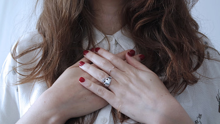 Photo by Giulia Bertelli woman wearing silver-colored ring